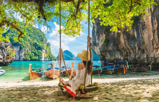 Joyful backpackers, relishing their summer holiday, delight in exploring the wonders of Thailand.