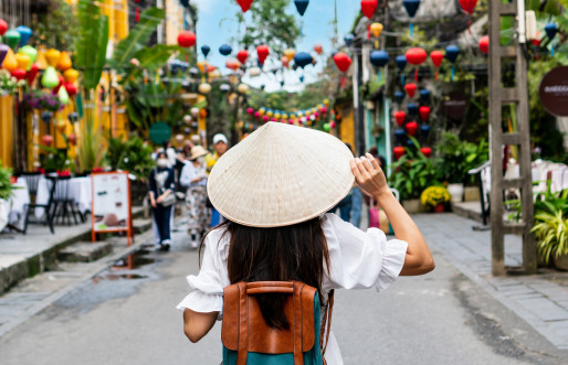 Young woman tourist with backpack walking, Vietnam.